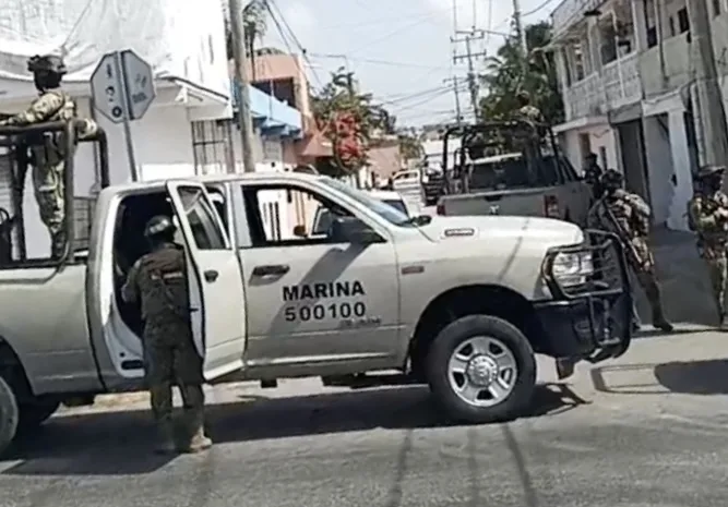 Aerial view of a residential area in Cancun during a police operation