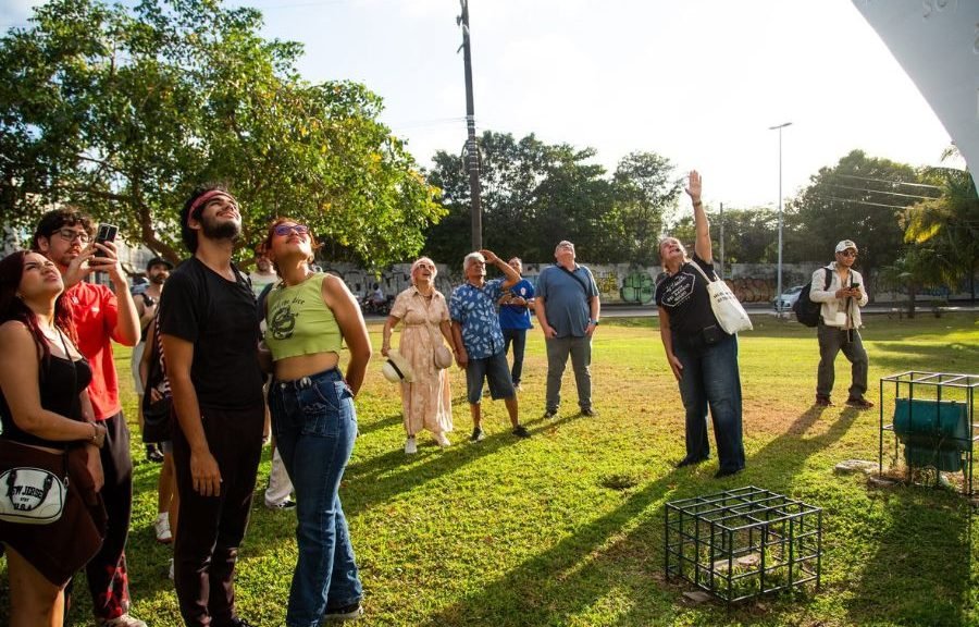 People walking through Cancun's founding zone during a historical tour led by Tiziana Roma