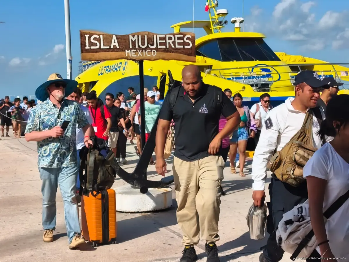 Tourists enjoying the beach and clear waters on Isla Mujeres, Quintana Roo