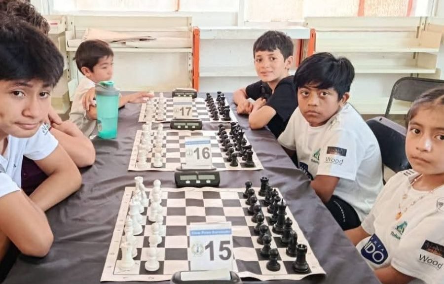 Two young chess players from Tulum, Mexico, competing in Medellin Colombia