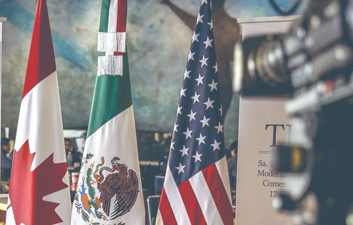Flags of Mexico, the United States, and Canada representing the USMCA trade agreement