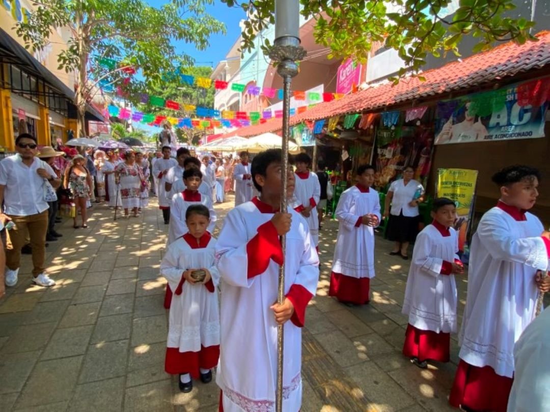 Procession of the Virgen del Carmen statue along Quinta Avenida in Playa del Carmen