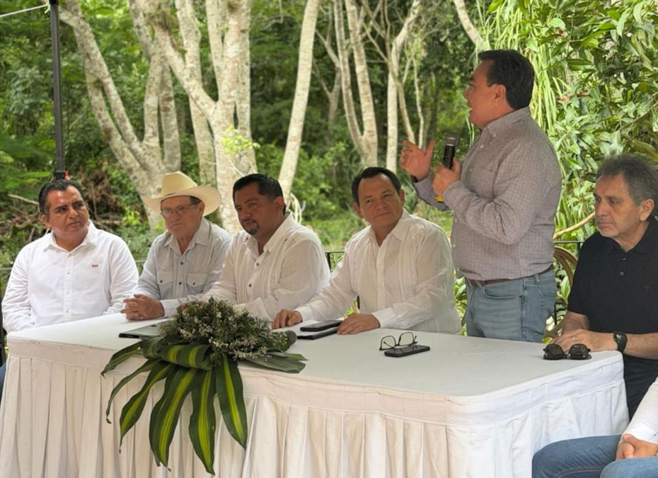 Yucatan Governor Joaquin Diaz Mena seated at a table with business leaders and local officials in Valladolid