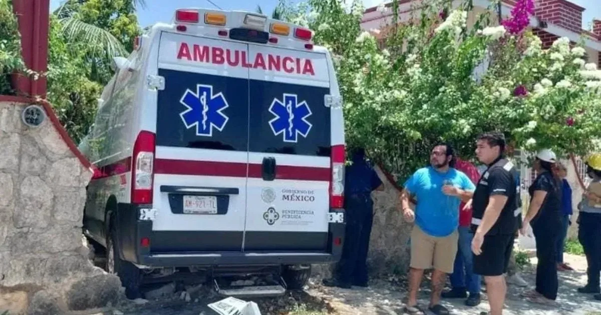 An ambulance rests inside a damaged home after a collision in Chetumal, Quintana Roo.