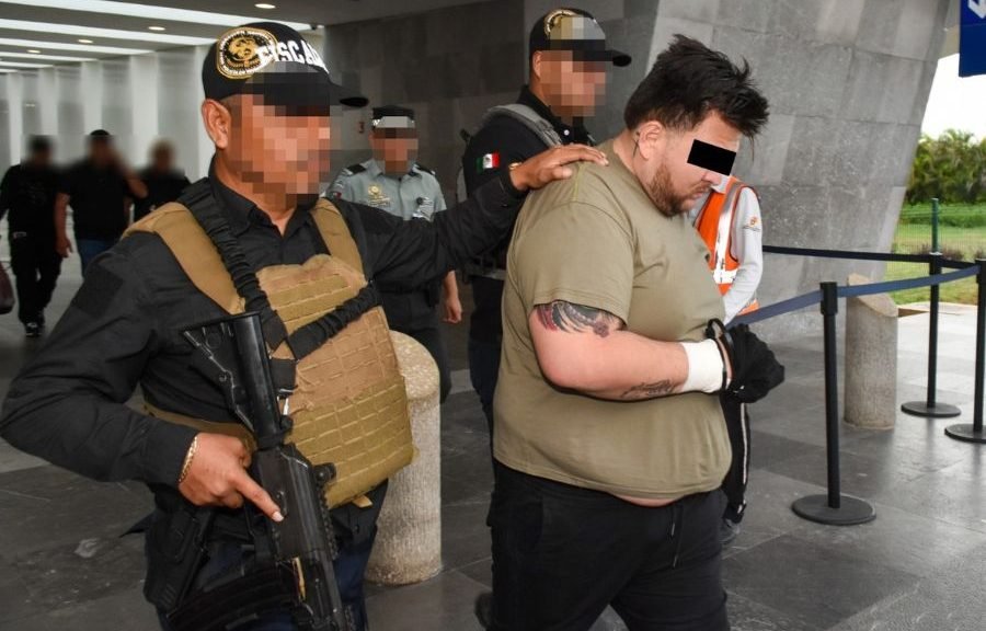 Mexican police escort a handcuffed man believed to be El Ruso during his arrest in Zapopan