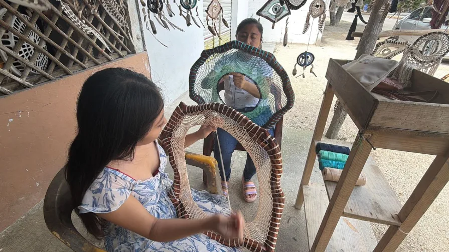 Women artisans and traditional cooks from Quintana Roo work on handmade crafts as part of a new cooperative network.