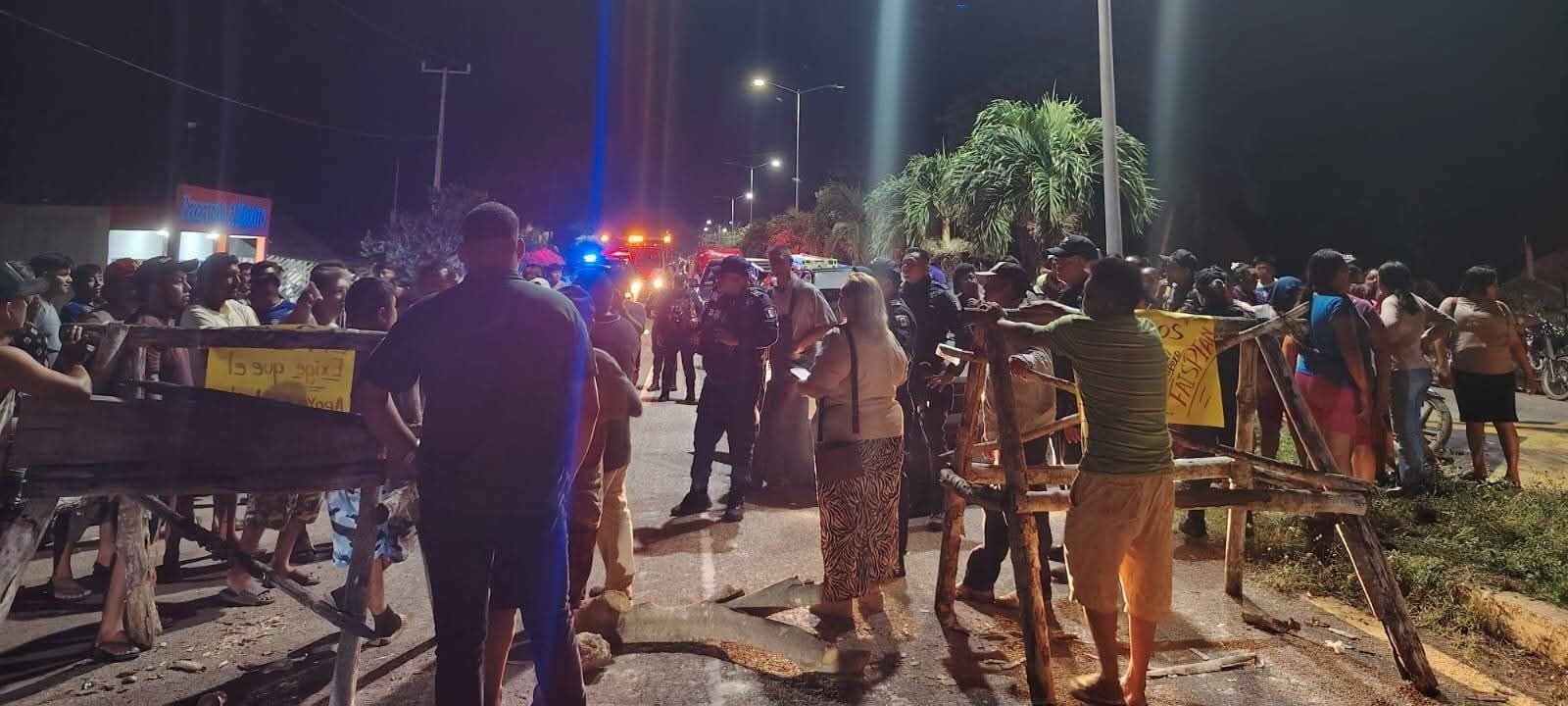 Residents block the Chetumal-Merida highway with logs and stones during a protest in La Pantera, Bacalar