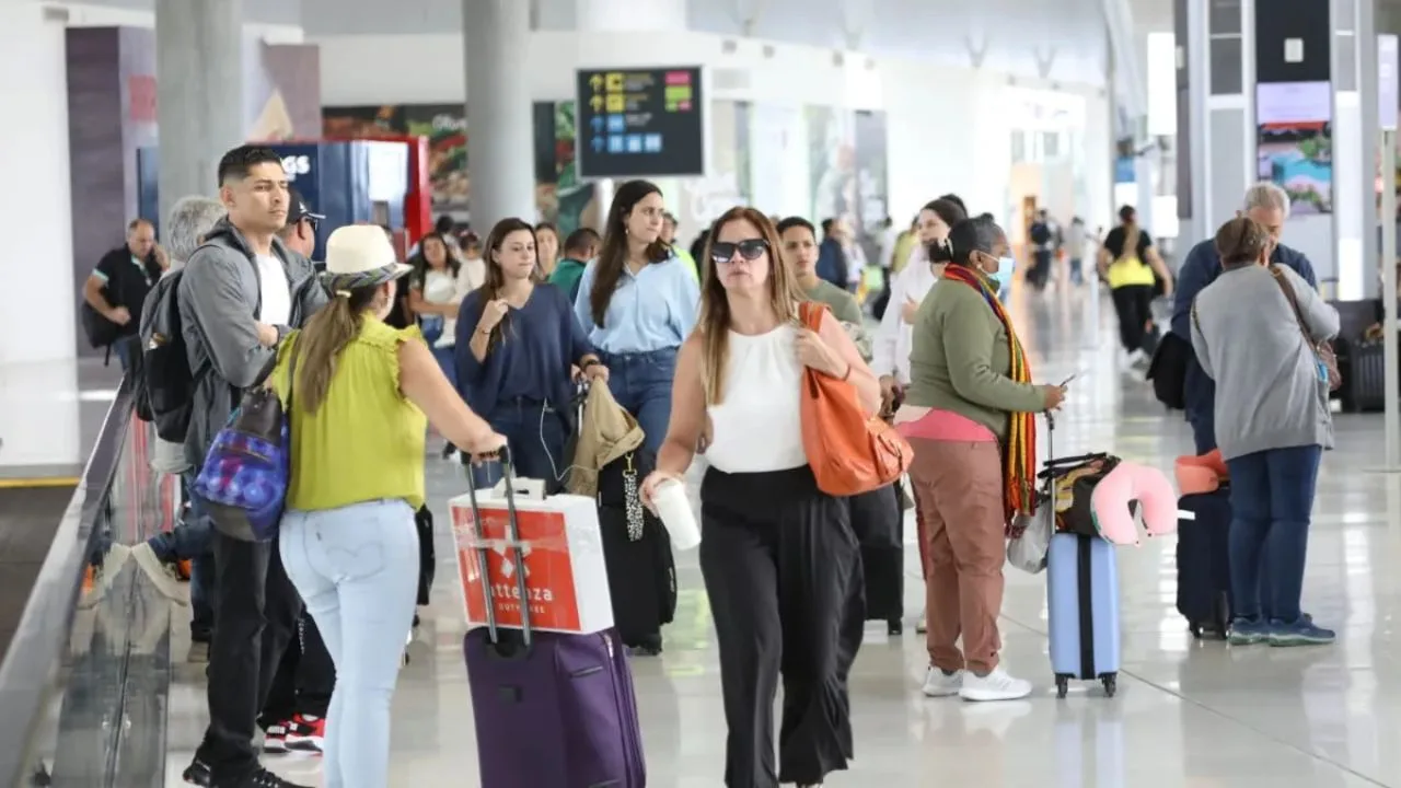 Passengers walk through Cancun International Airport terminal during the 2026 World Cup season.