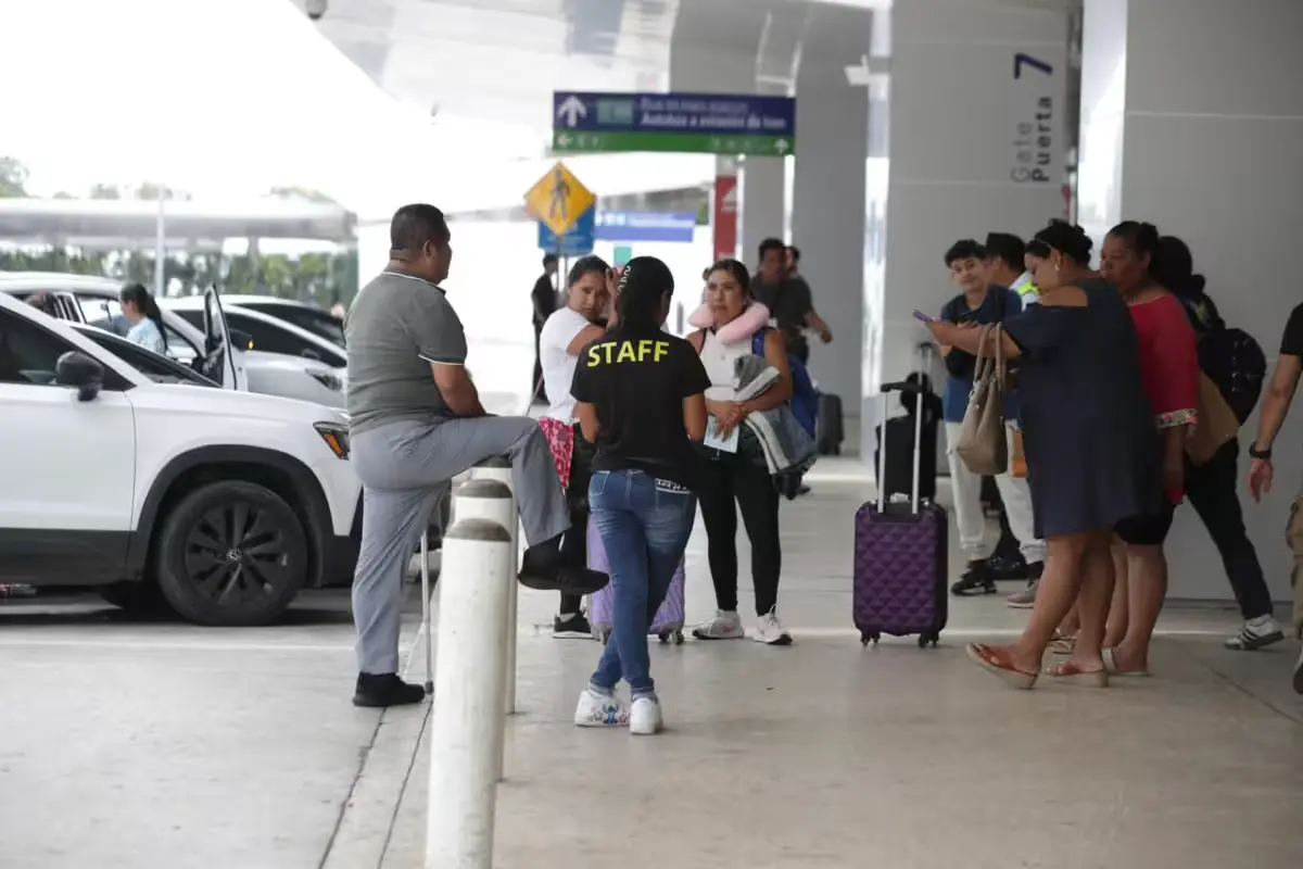 Passengers struggle to find seating in Terminal 2 at Cancun International Airport