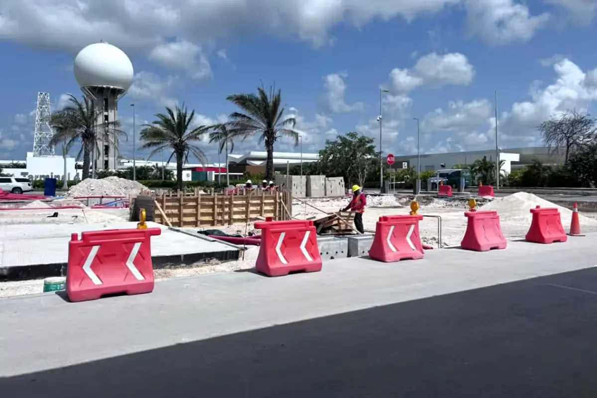Barriers and construction equipment outside Terminal 4 at Cancun International Airport reduce road access and confuse drivers.