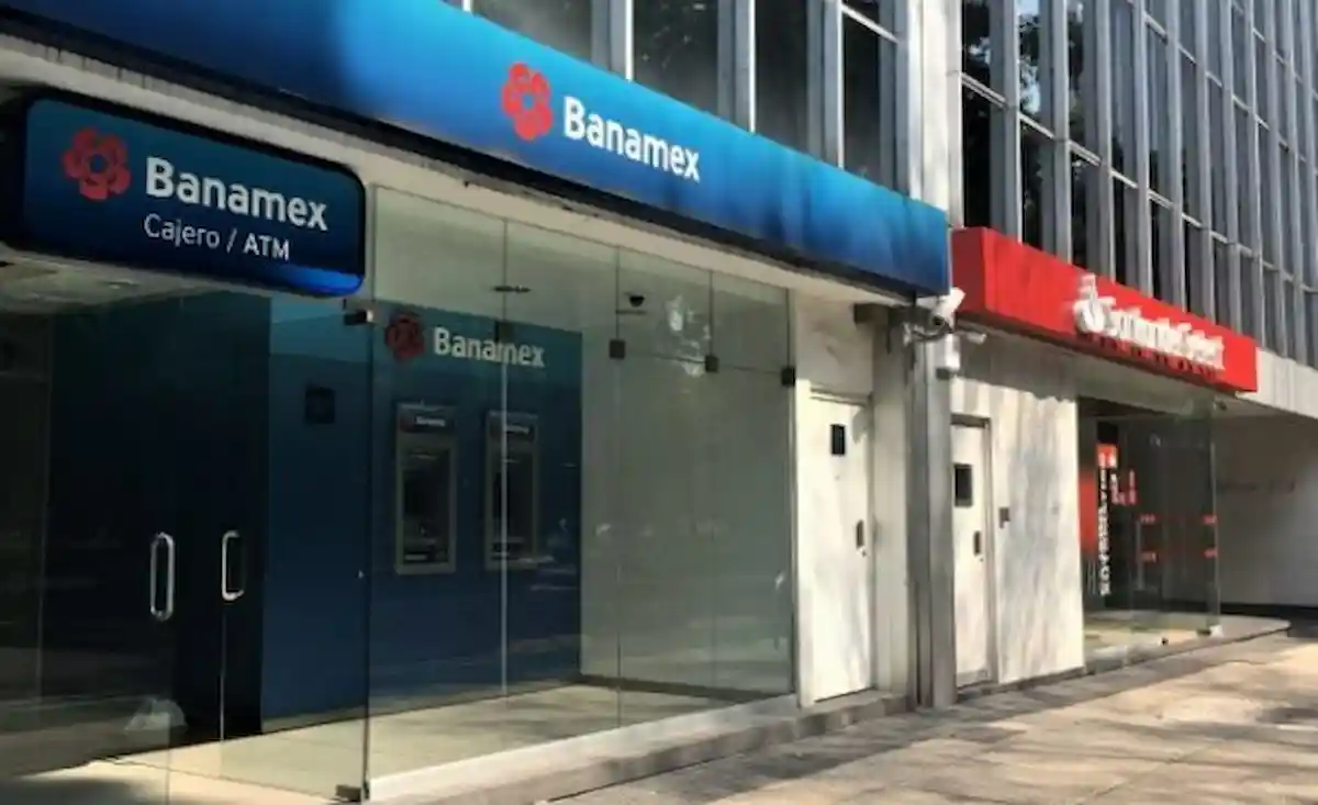 Teller windows at a bank branch in Cancún, many closed due to staffing shortages.