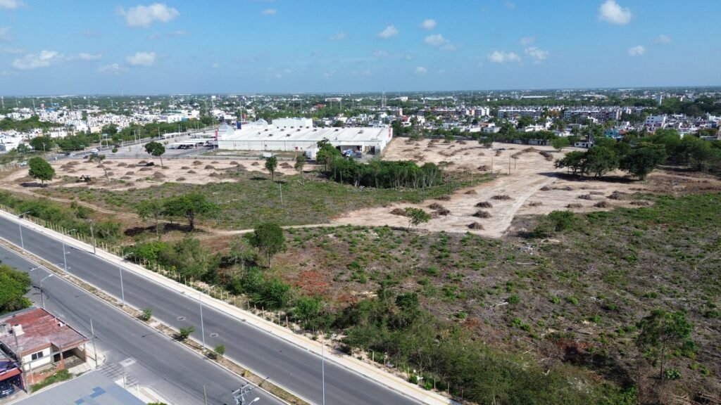 Security personnel guard the former fairgrounds property on Avenida Nichupté in Cancún.