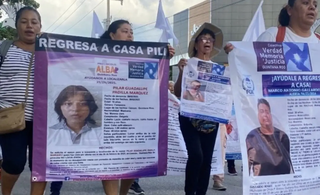 People gather at Parque de Las Palapas in Cancun for an event honoring missing persons and their families.
