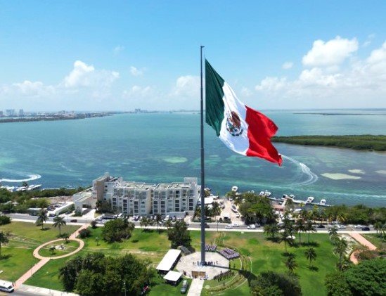 Hotel zone beach in Cancun with visitors during summer vacation season