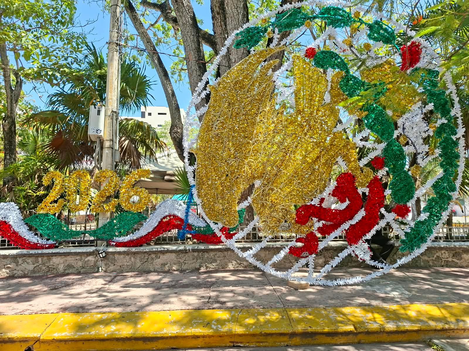 Workers perform maintenance on the facade of the Municipal Palace in Cancun, Mexico, ahead of Independence Day celebrations.