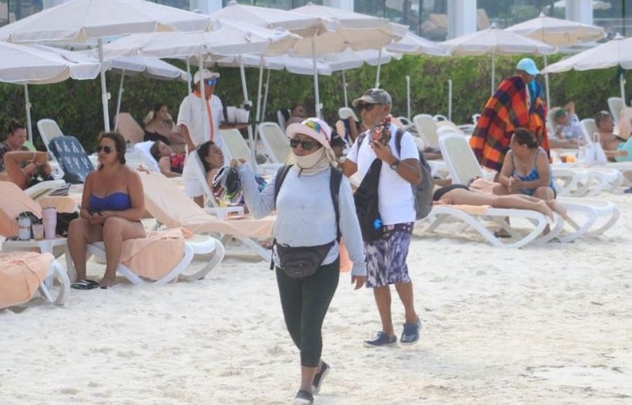 Street vendors selling handicrafts on a beach in Cancún