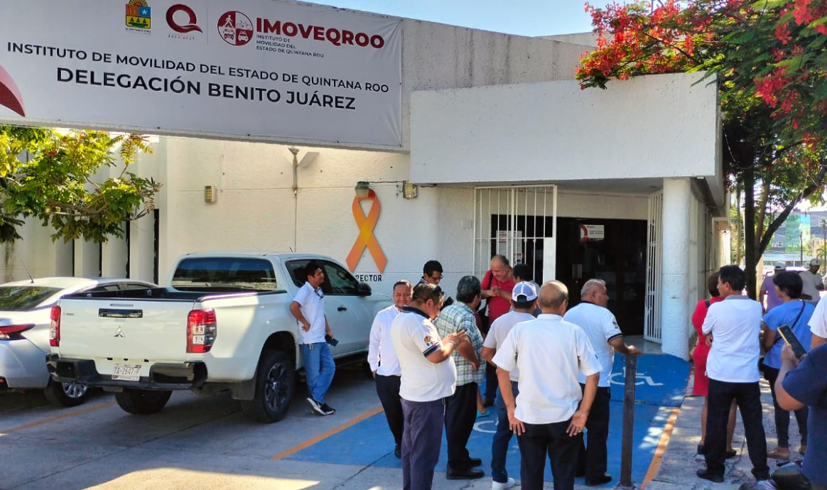 Cancun taxi drivers gather outside the Imoveqroo office to protest Uber and unlicensed transportation