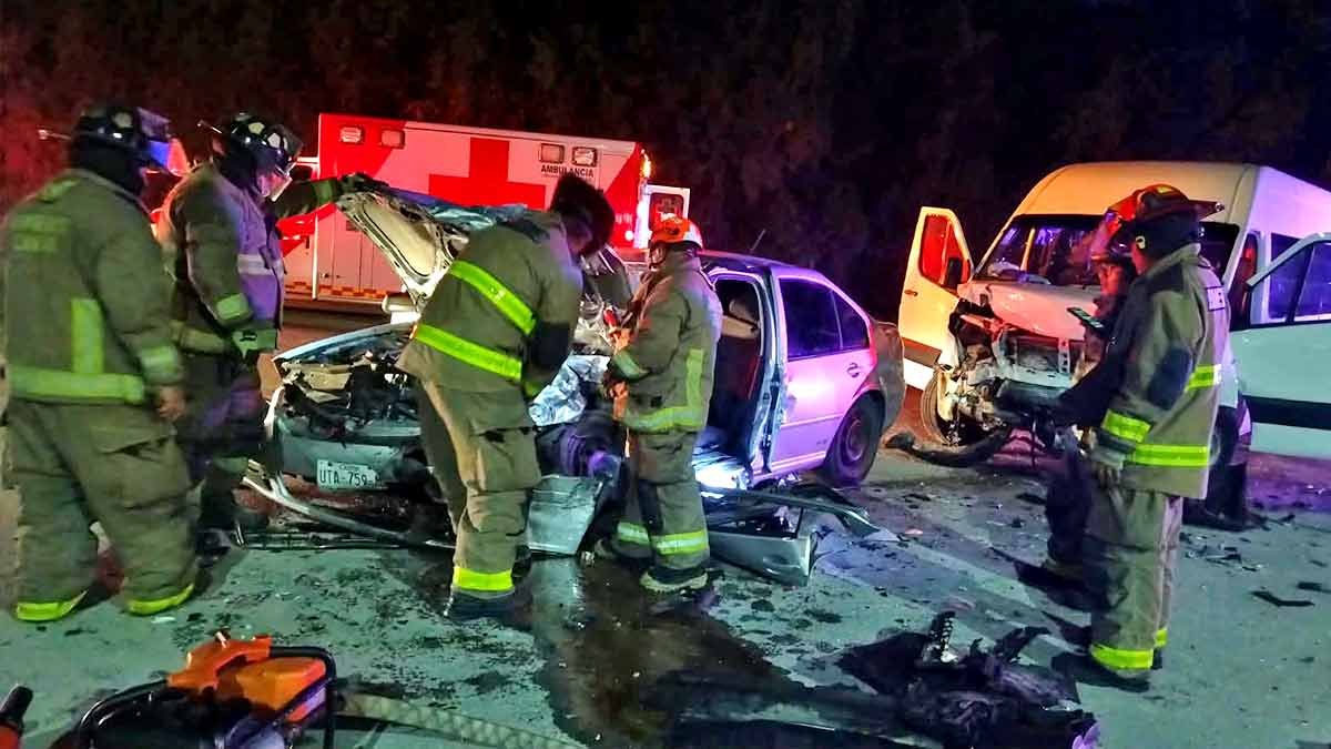 Emergency responders work at the scene of a collision between a tourist van and a car in Cancun, Quintana Roo.