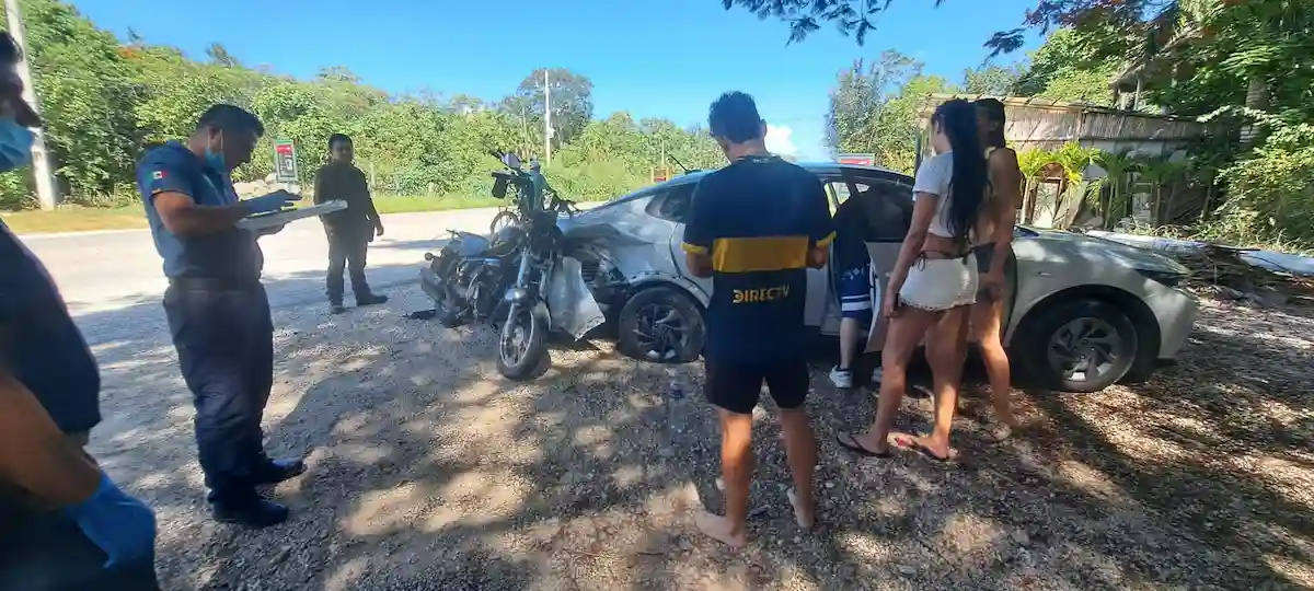 A motorcycle and a rented car after colliding at the entrance to Cenote Atik on the Tulum-Cobá highway in Tulum, Quintana Roo.