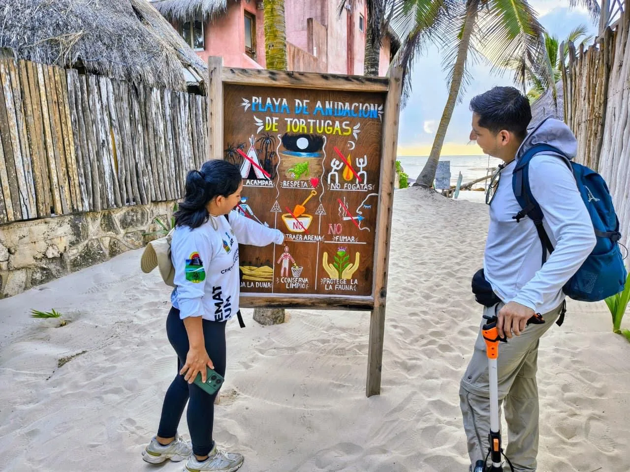 Conchita Beach in Tulum with white sand, palm trees, and clear turquoise water
