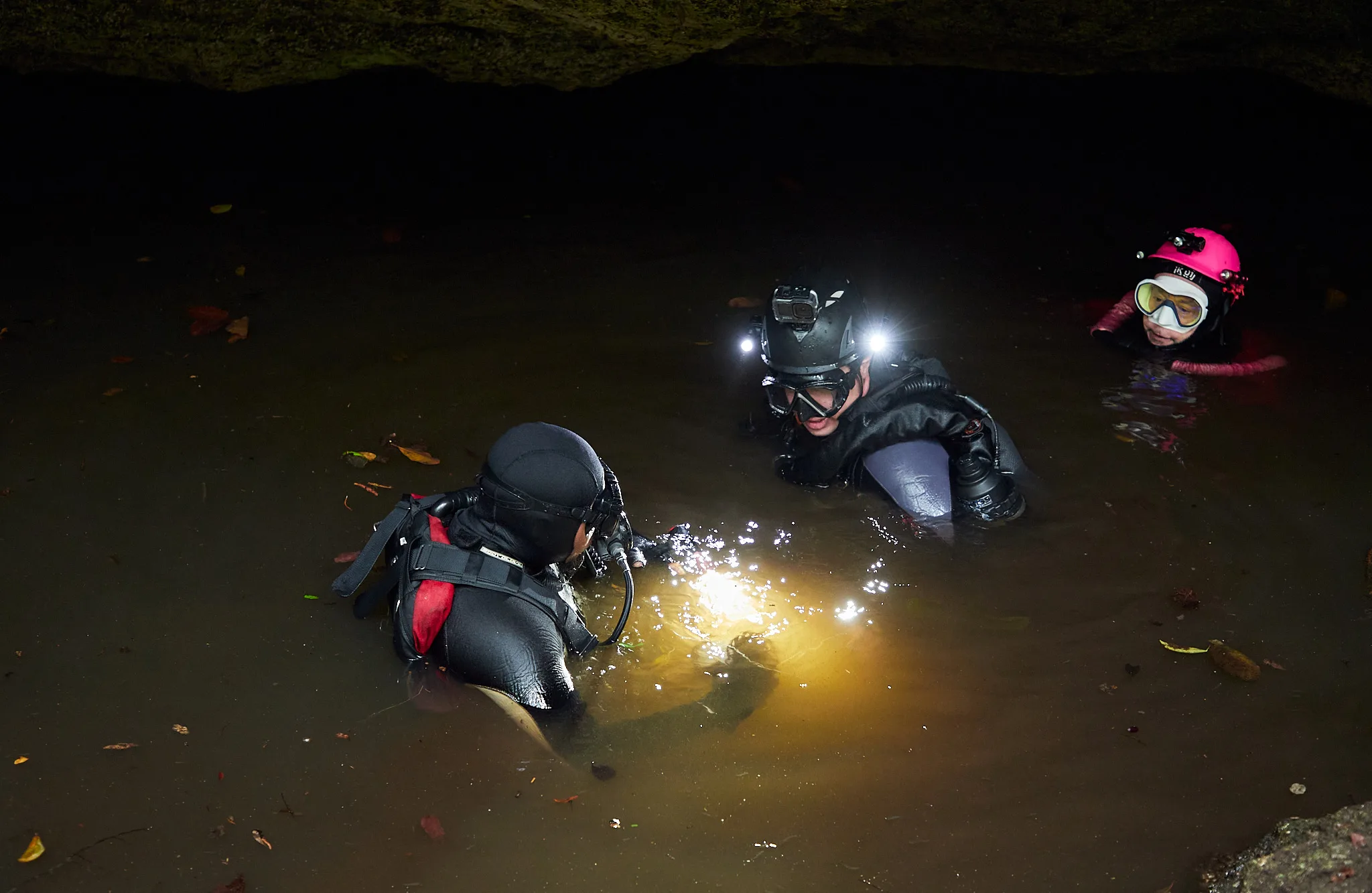 Speleologist sampling groundwater from an underground gallery in Cozumel