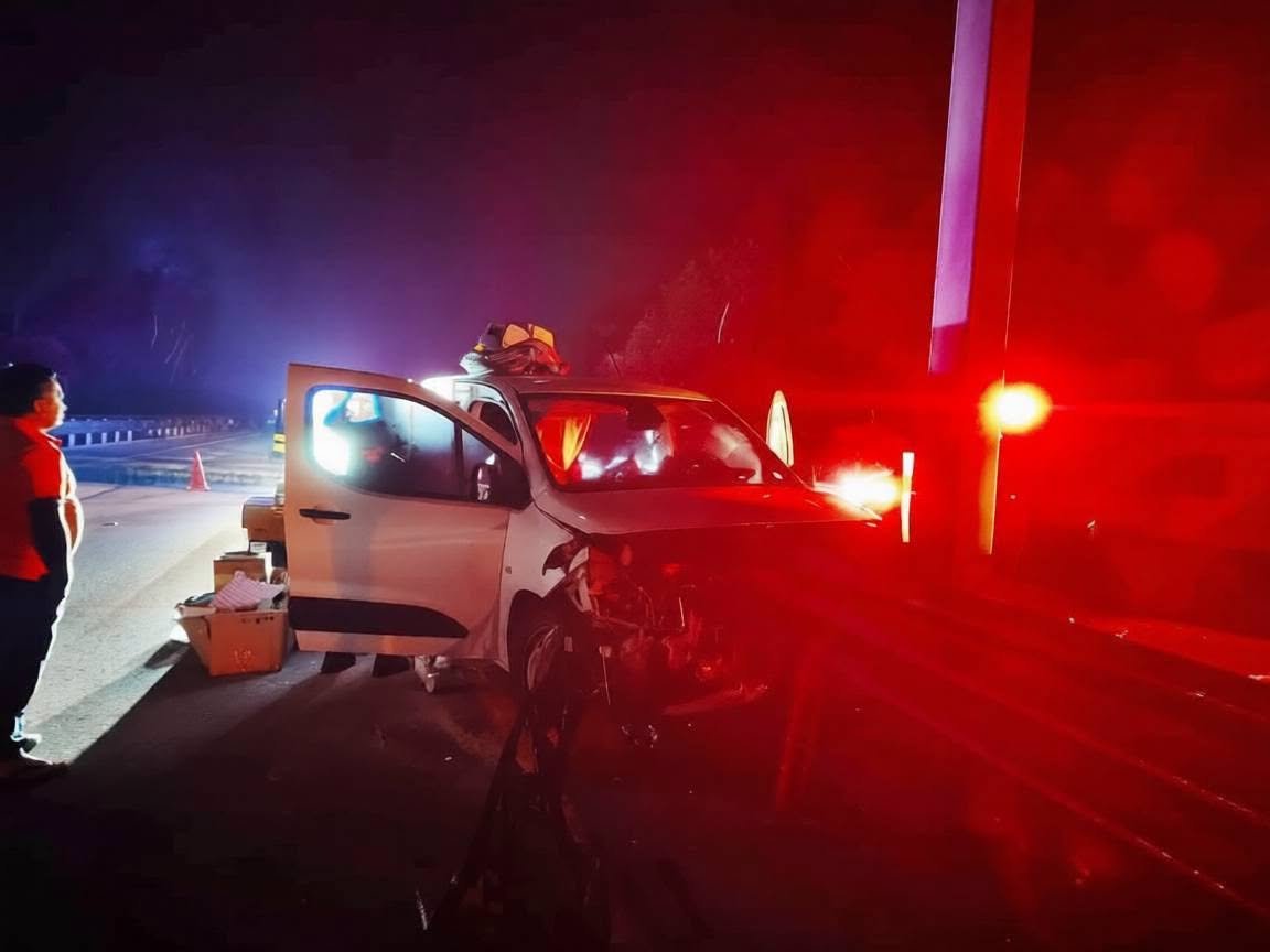 Emergency crews work at the scene of a crash on the Merida-Cancun highway where a driver lost his forearm after hitting a guardrail.
