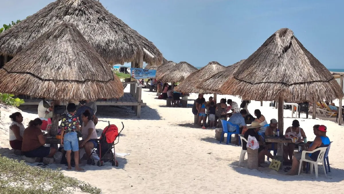 Vacationers fill the beach at El Cuyo during the final weekend of the Beach Festival