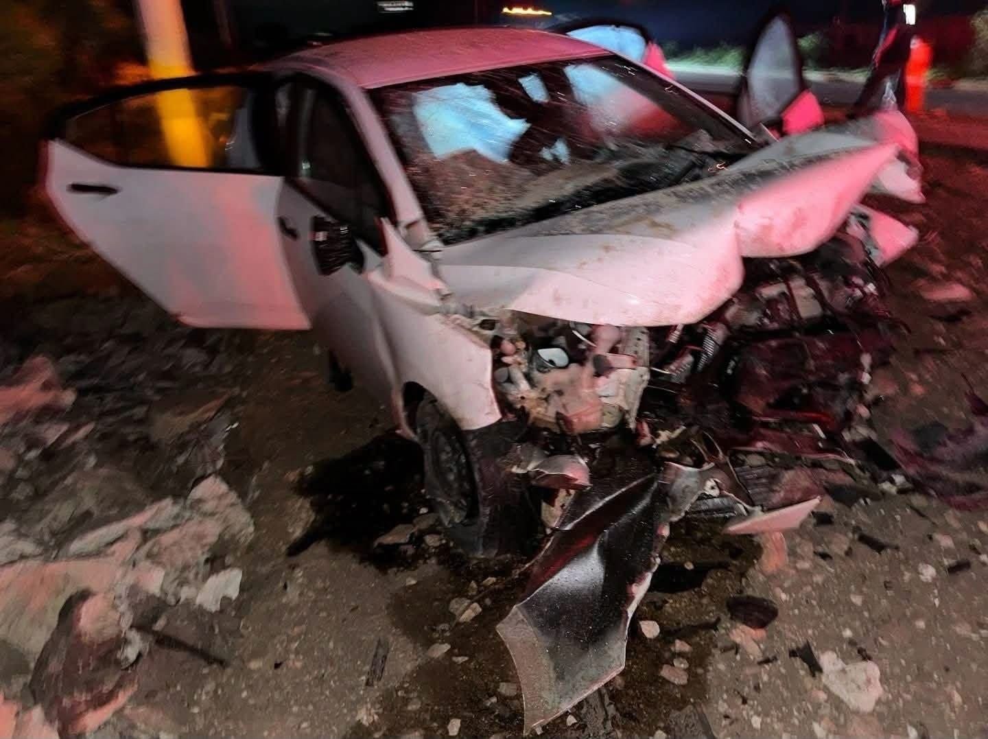 Emergency crews and National Guard officers at the scene of a fatal crash on the Puerto Aventuras-Tulum section of Federal Highway 307.