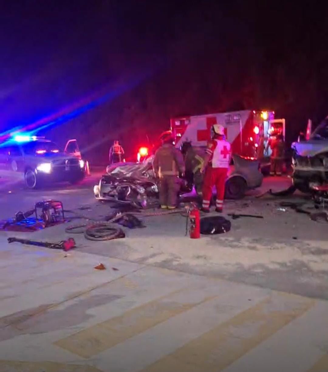 Emergency personnel work at the scene of a crash on the Merida-Cancun bypass that left five people injured.