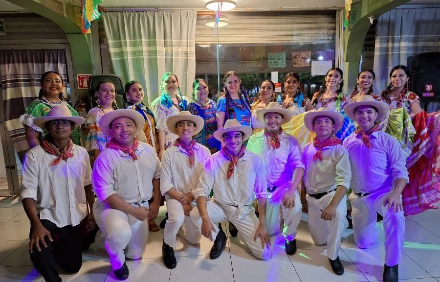 Dancers in colorful Oaxacan attire perform during Guelaguetza 2026 at the Toltecayotl Cultural Center in Cancun.