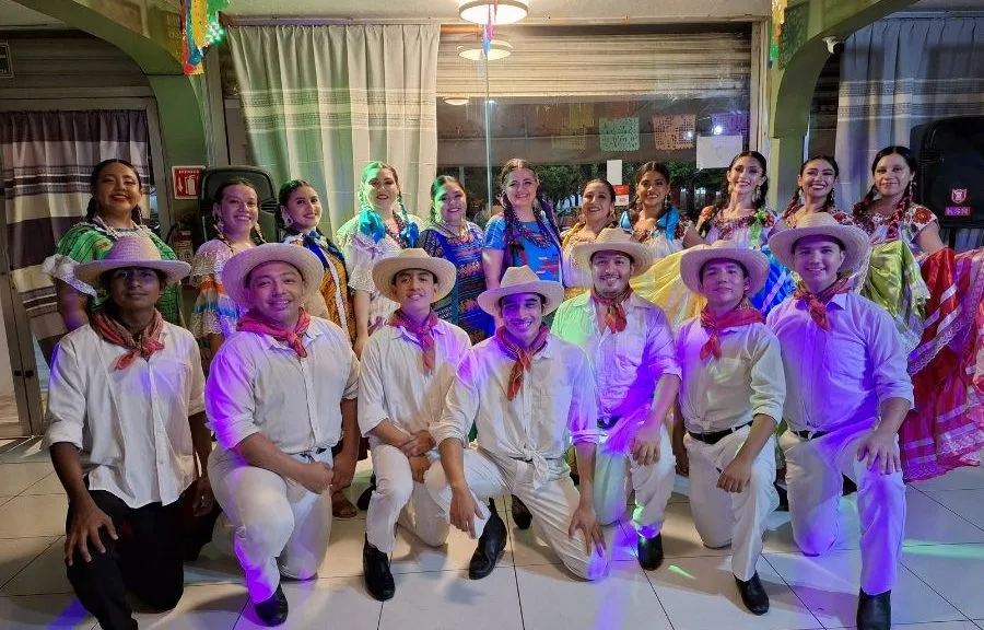 Dancers in colorful Oaxacan attire perform during Guelaguetza 2026 at the Toltecayotl Cultural Center in Cancun.