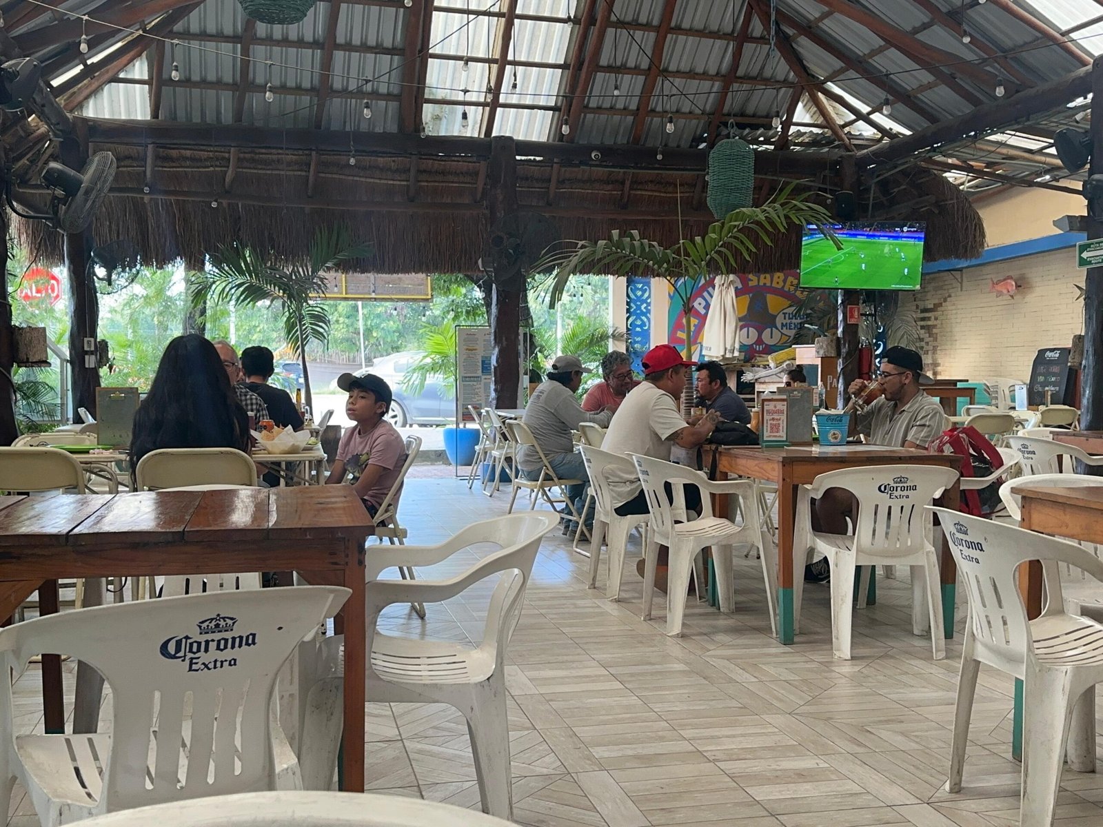 Health inspector reviewing food handling practices at a restaurant in Quintana Roo