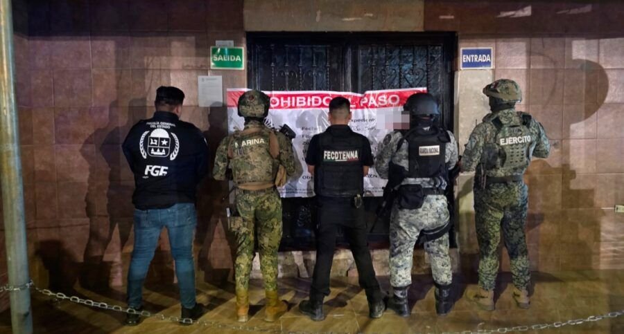 Police officers taking part in an anti-trafficking operation at a bar in Quintana Roo, Mexico
