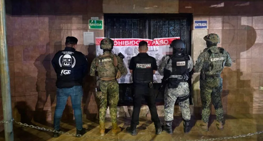 Police officers taking part in an anti-trafficking operation at a bar in Quintana Roo, Mexico