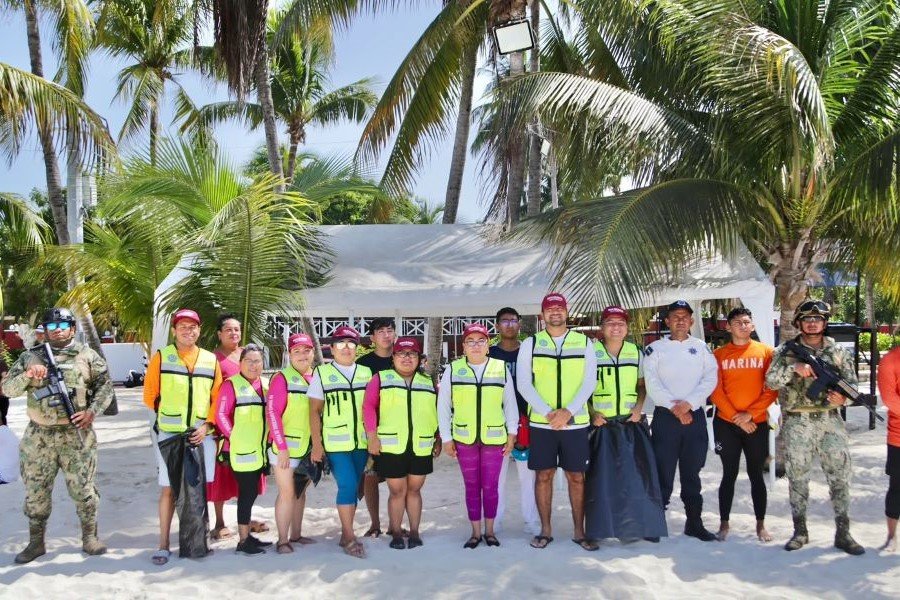 Police officers patrolling a beach on Isla Mujeres during the summer vacation operation