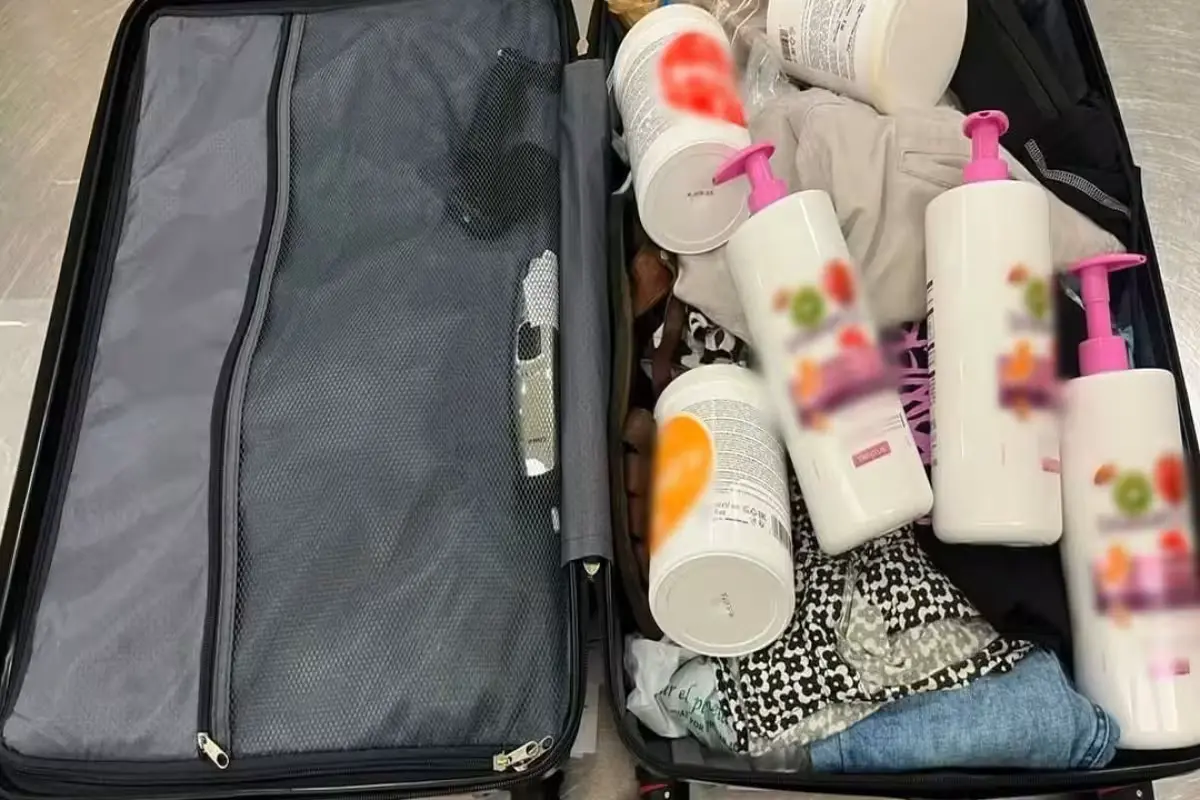 National Guard officers inspecting an abandoned suitcase containing ketamine at Cancún International Airport.
