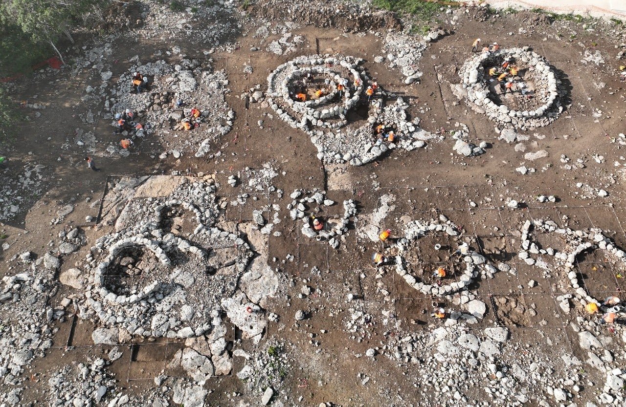 Excavated stone structures at the K'oxol Ja' II Maya settlement in Yucatan, discovered during Maya Train construction.