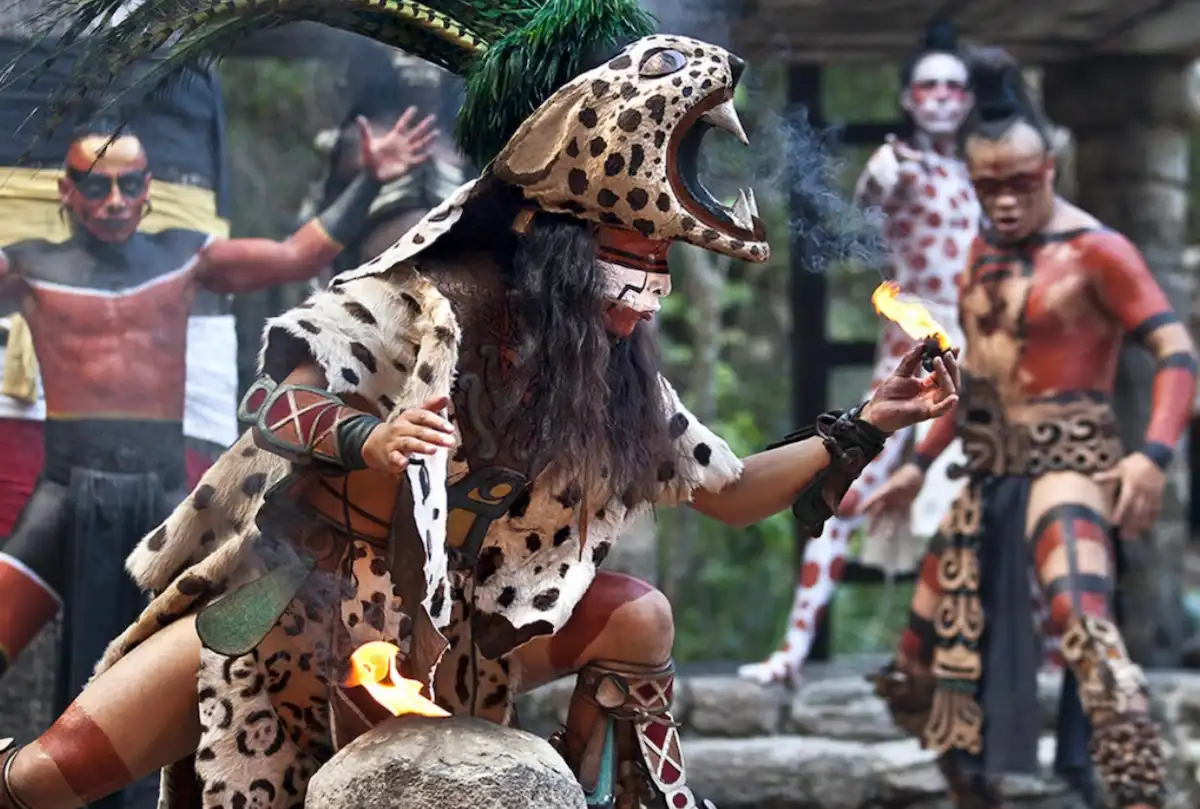 Maya dignitaries in traditional attire during a meeting about supporting Grupo Xcaret and preserving indigenous employment