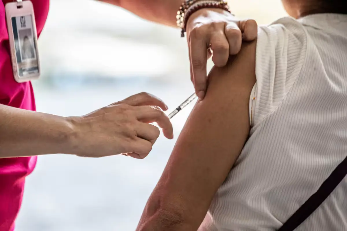 People receive measles vaccines at a health center in Quintana Roo