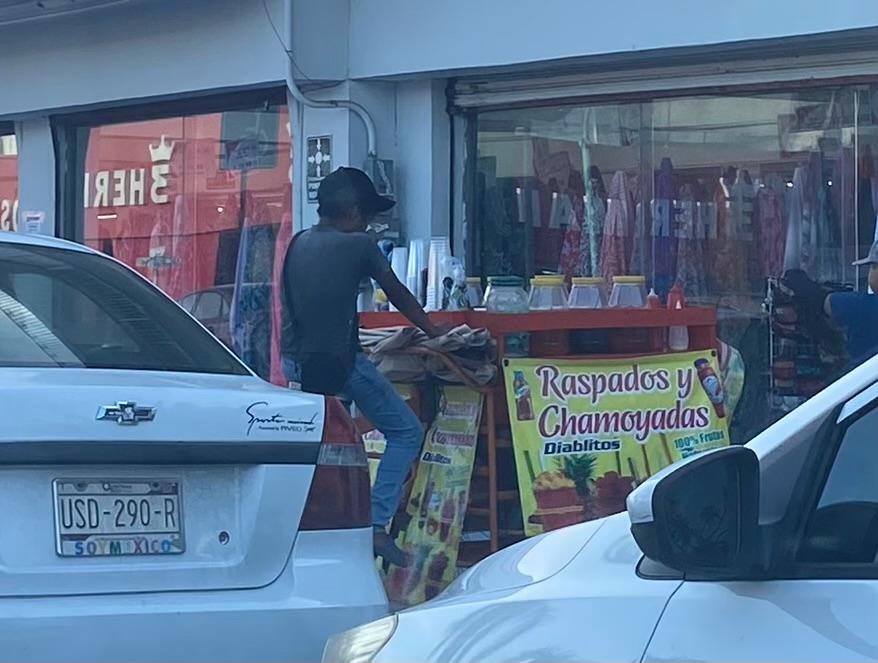 Children selling handicrafts on a street in Chetumal, Quintana Roo