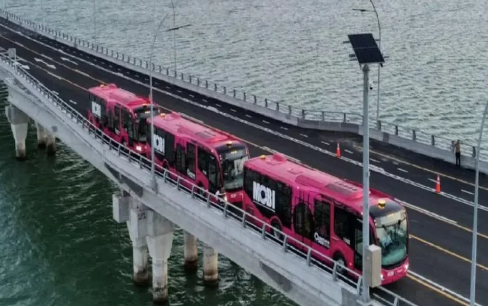 A MOBI transit vehicle crosses the Nichupté Bridge in Cancún, Quintana Roo.