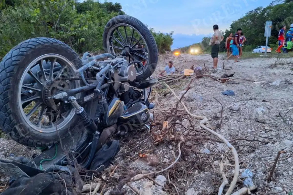 Paramedics and authorities at the scene of a fatal motorcycle accident on Federal Highway 307 in Quintana Roo, Mexico