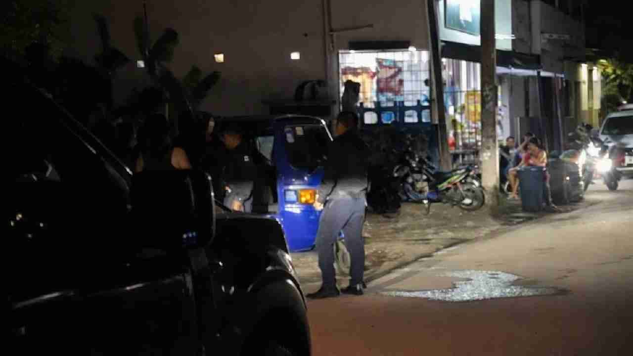 Police officers patrol the San Alfredo neighborhood in Cancun, Mexico, following a deadly shooting at the El Paisa cocktail bar.