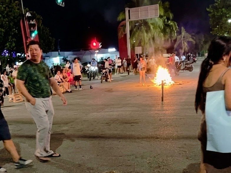 Residents block an intersection in Playa del Carmen during a protest over recurring power outages