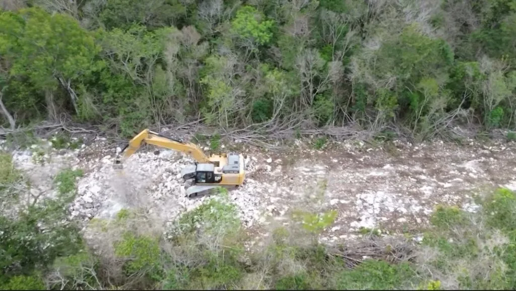 Construction of a road across jungle over the Sac Actún cave system near Tulum, Quintana Roo