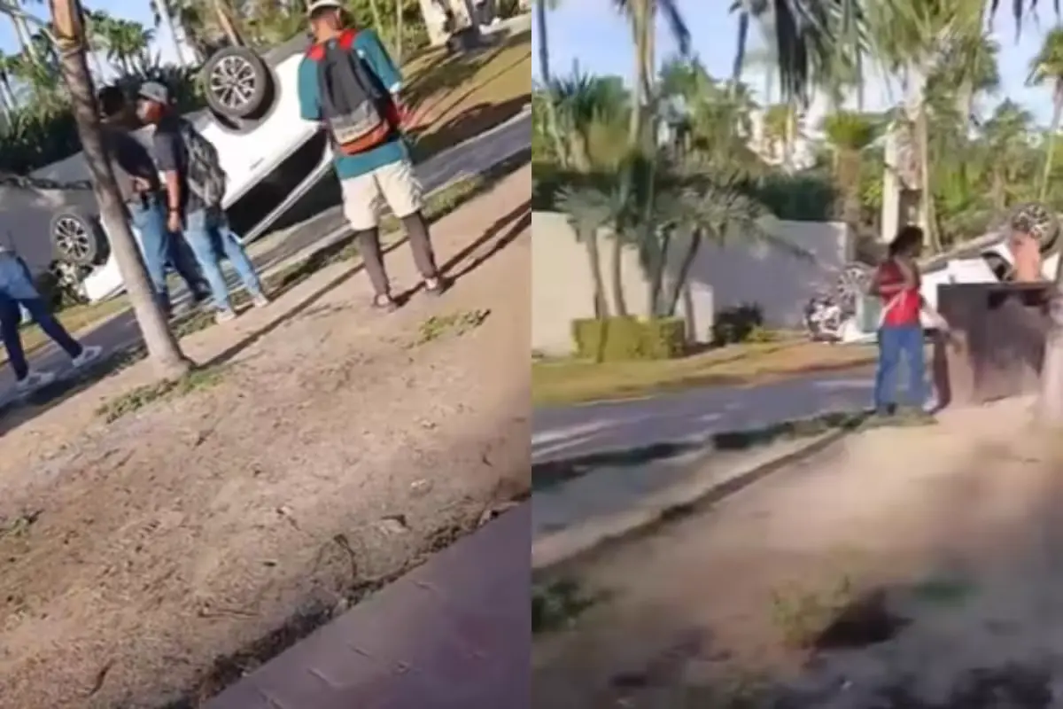 An overturned SUV on Boulevard Kukulcán in Cancún's Hotel Zone after a crash that injured a construction worker.