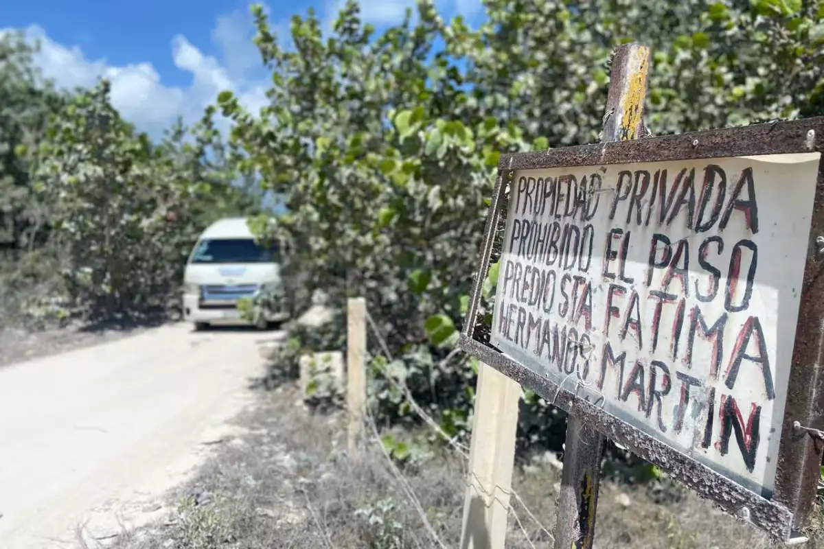 Residents of Santa Fátima and Francisco Javier settlements display property documents in the Cancún-Isla Blanca corridor.