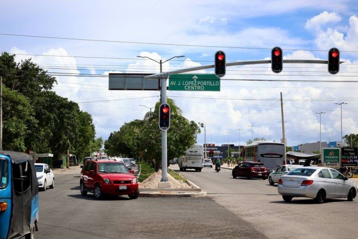 Traffic lights being installed at a busy intersection in Cancun, Quintana Roo, Mexico.