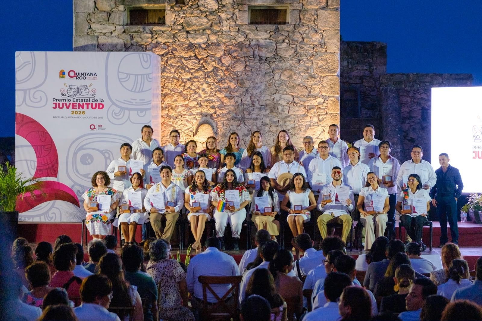 Governor Mara Lezama presents the State Youth Award to honorees at the Fuerte de San Felipe in Bacalar