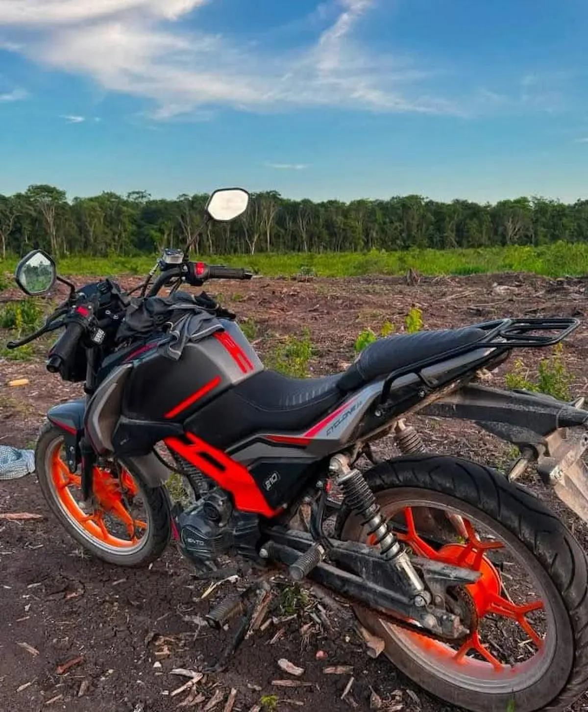 Security camera image captures a man stealing a black and orange motorcycle from a home in Bacalar